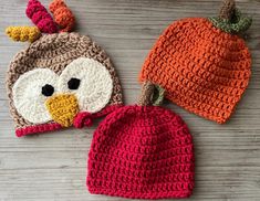 two crocheted hats with an owl face on one and a pumpkin hat on the other