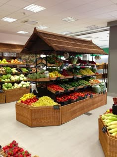 the produce section of a grocery store with fresh fruits and veggies on display