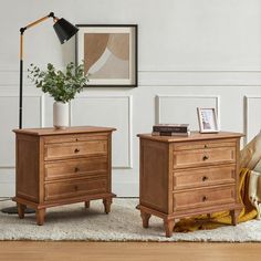 two wooden nightstands sitting next to each other on a rug