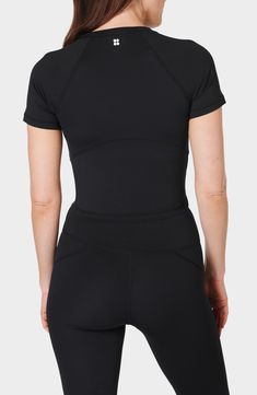 Work out or chill out in this stretchy cropped T-shirt framed by sporty raglan sleeves. 17 1/2" length (size Medium) Crewneck Short sleeves 80% recycled polyester, 20% elastane Machine wash, dry flat Imported Black Athleisure Cropped T-shirt For Workout, Sporty Black Crop Top T-shirt, Fitted Black Athleisure T-shirt, Athleisure Stretch Cropped T-shirt With Short Sleeves, Sporty Stretch T-shirt With Raglan Sleeves, Athleisure Short Sleeve Crew Neck Top For Workout, Sporty Fitted Crop Top T-shirt, Moisture-wicking Stretch Cropped T-shirt With Crew Neck, Sports Cropped T-shirt With Moisture-wicking Stretch