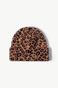 a leopard print beanie hat on a white background