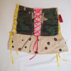 Creatively Redesigned Skirt From 2006, New With Tags. The Base Is A Linen Skirt From Moda International, But "Diva's By Monica" Added Front And Back Pockets From A Pair Of Mudd Camo Pants And Ribbons That Look Like Corset Lacing. The Tag Is Handwritten And Says That It Was Made In 2006. Good Condition, Only Flaws Being A Couple Tiny Brown Dots Near The Bottom, Probably Spills From The Paint Used To Create The Polka Dots. Tag Says Size 8. Waist Is 14.25" And Length Is 17". Y2k Fitted Skirt For Streetwear, Green High Waist Y2k Skirt, Y2k High Waist Green Skirt, Fitted Y2k Skirt For Streetwear, Green Y2k Mini Skirt, Y2k Patchwork Bottoms For Summer, Y2k Mini Skirt For Festivals, Y2k Style Mini Skirt In Green, Y2k Mini Skirt For Spring Festival