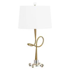 a gold lamp with a white shade on the top and two lights attached to it