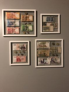 four framed currency pieces on the wall