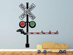 a wall decal with a traffic light and railroad crossing sign on it's side