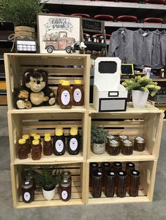 the shelves are filled with honey jars and stuffed animals