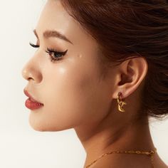 Embrace celestial elegance with Moon Drop Earrings, exquisitely crafted in 18k gold plating. These enchanting earrings feature a delicate moon design that gracefully dangles, adding a touch of mystical charm and elegance to any look. Gold Nugget Ring, Mens Earrings Studs, Moon Drop, Sterling Silver Stacking Rings, Bangle Ring, Geometric Heart, Open Hoop Earrings, Baroque Pearl Earrings, Bow Ring