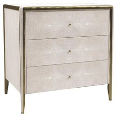 a white and gold dresser with three drawers