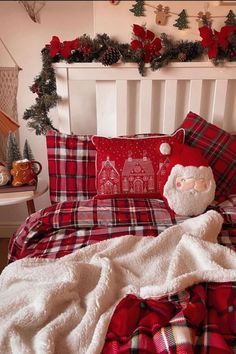 a christmas themed bedroom with plaid bedding and decorations