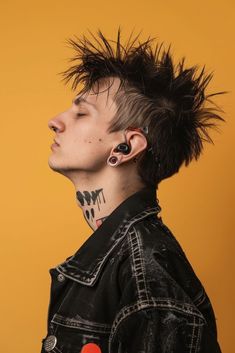 a young man with punk hair and piercings