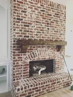 an old brick fireplace is being restored