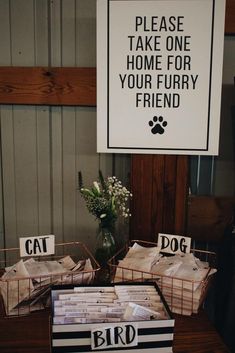 there is a sign that says please take one home for your furry friend on the table