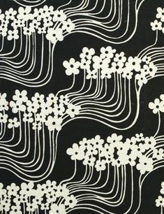 a black and white pattern with flowers on it