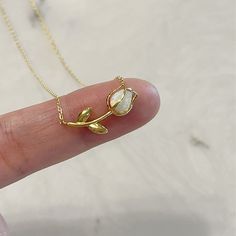 "Opal Tulip Necklace Chain: 15\" 18k Gold dipped over brass Color: Gold, Silver and Rosegold Pendant: 20mm Ready for a Gift 🎁" خواتم خطوبة, Tulip Necklace, Inexpensive Jewelry, Jewelry Accessories Ideas, Dope Jewelry, Classy Jewelry, Charm Necklaces, Fancy Jewellery, Funky Jewelry