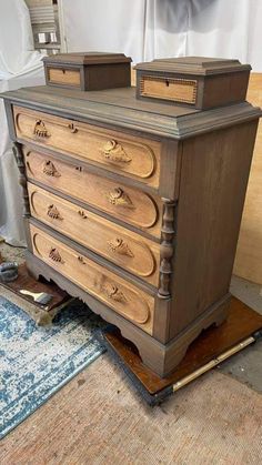 an old dresser is sitting on the floor