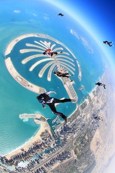 a man flying through the air while riding a skateboard in front of an island