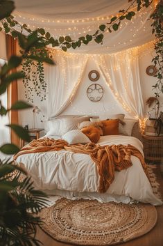 a bed with white sheets and lights on the headboard is surrounded by greenery