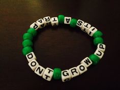 Don't Grow Up It's a Trap Peter Pan Kandi Bracelet by KandilandUSA Rave Kandi Ideas Funny, Green Kandi Bracelets, Lesbian Kandi Bracelet, Trans Kandi Bracelet, Peter Pan Costumes