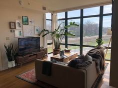 a living room filled with furniture and a flat screen tv