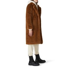 Camel brown faux fur (100% Polyester). Jacket. Long sleeves. Front hook-and-eye closure. Fully lined. Front Pockets. 25" from shoulder to hemline. Imported. Brown Faux Fur Winter Outerwear, Brown Faux Fur Long Coat, Brown Shearling Outerwear For Fall, Faux Fur Coat For Workwear In Mink Color, Chic Brown Shearling Outerwear, Faux Fur Mink Color Coat For Work, Fall Faux Fur Lined Mink Outerwear, Fall Mink Outerwear With Faux Fur Lining, Brown Outerwear With Faux Fur Trim For Work