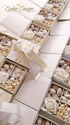 a white box filled with lots of different types of candies next to each other