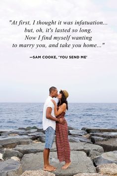 a man and woman kissing on the rocks by the ocean with a quote from frank shanata