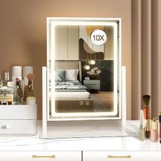 a white dresser topped with lots of makeup and personal care items in front of a mirror