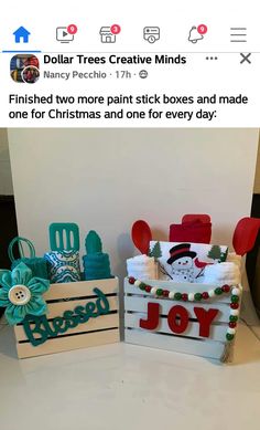 two wooden boxes with christmas decorations on them