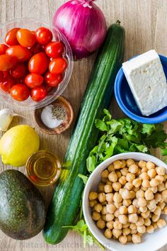 vegetables and other foods are arranged on a table