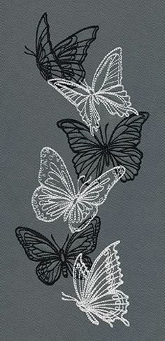 three black and white butterflies on a gray background