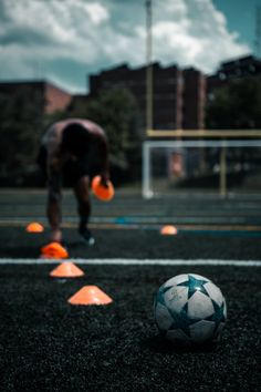 a soccer ball sitting on top of a field