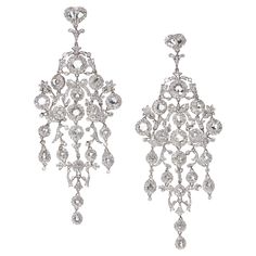 A pair of large chandelier diamond earrings, with clusters of rose-cut diamonds, surrounded by round brilliant-cut diamonds, on an articulating, diamond pave set, openwork frame of scrolls and flowers, with an approximate total diamond weight of 15.26ct, mounted in platinum. Diamond Chandelier Earrings, Diamond Chandelier, Large Chandelier, Large Chandeliers, Fancy Jewelry, Rose Cut Diamond, Round Brilliant Cut Diamond, Round Brilliant Cut, Chandelier Earrings