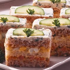 several slices of cake with cucumbers on top