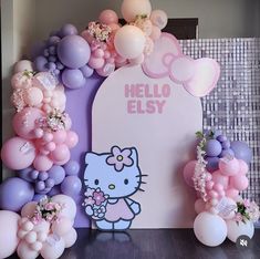 a hello kitty birthday party with balloons and decorations