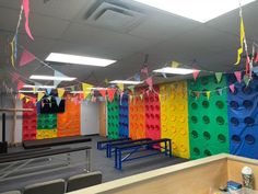 an office decorated in rainbow colors and streamers