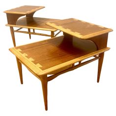 two wooden tables sitting on top of each other