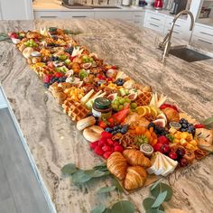 a long table filled with lots of different types of food