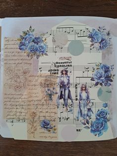 a piece of paper with blue flowers and music notes