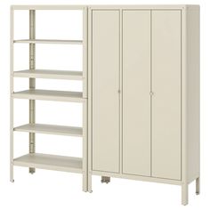 a white cabinet with four shelves next to each other