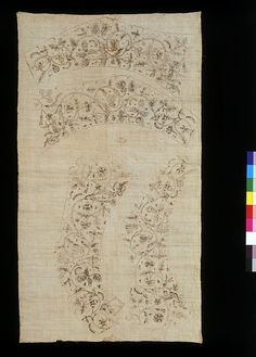 an old piece of cloth with designs on it