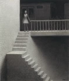 a woman standing on top of a set of stairs