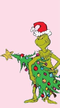 the grinch is holding a christmas tree