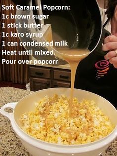 a woman pours orange juice into a bowl of popcorn