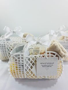 three white baskets filled with different types of items