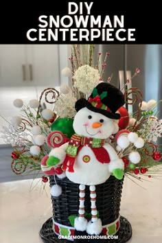 a snowman is sitting in a basket with candy canes