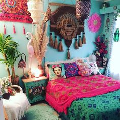 a bedroom decorated in bright colors with lots of decorations