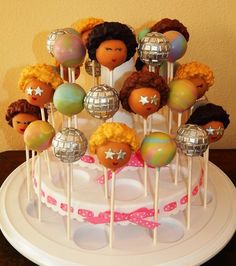 there are many cake pops on the plate