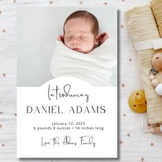 a birth announcement with a baby wrapped in a blanket