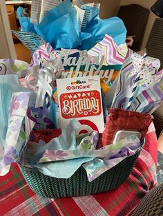 a birthday gift basket is sitting on a table