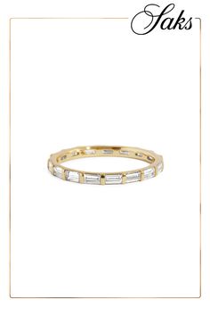 an 18k gold band with baguettes on the side and diamonds in the middle